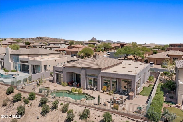 9432 N Longfeather, Fountain Hills, AZ 85268 - back of property with a fenced backyard, a patio, a residential view, and stucco siding