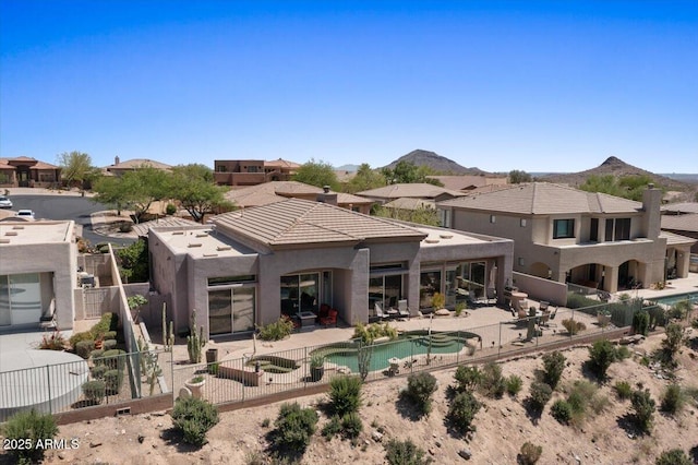 9432 N Longfeather, Fountain Hills, AZ 85268 - back of house featuring a fenced backyard, a patio, stucco siding, and a mountain view