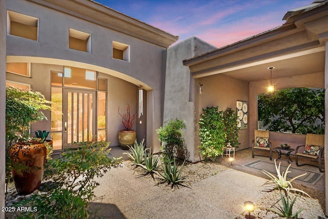 9432 N Longfeather, Fountain Hills, AZ 85268 - exterior entry at dusk featuring stucco siding
