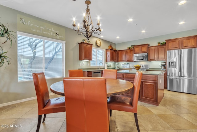 dining room featuring baseboards, light tile patterned floors, an inviting chandelier, and recessed lighting