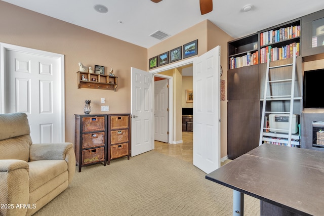 sitting room featuring light carpet, ceiling fan, and visible vents