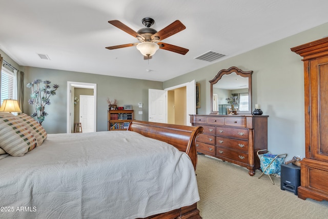 bedroom featuring carpet, visible vents, and a ceiling fan