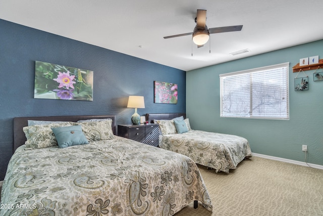 bedroom with baseboards, visible vents, ceiling fan, and carpet flooring