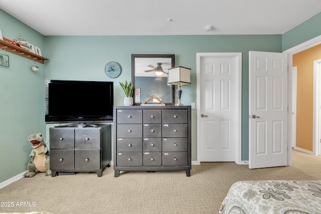 bedroom featuring baseboards and carpet flooring