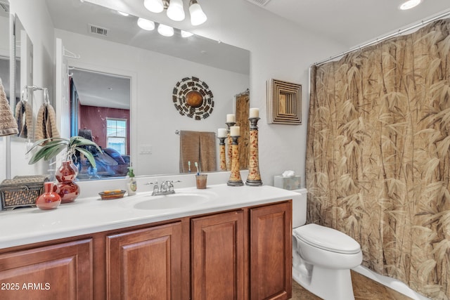 bathroom with a shower with curtain, visible vents, vanity, and toilet