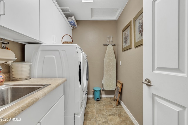 washroom featuring cabinet space, visible vents, attic access, independent washer and dryer, and baseboards