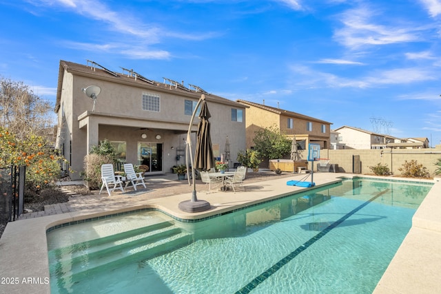 view of swimming pool with fence, a fenced in pool, and a patio