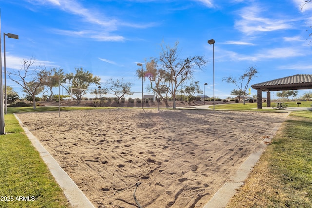 view of home's community with a lawn and volleyball court