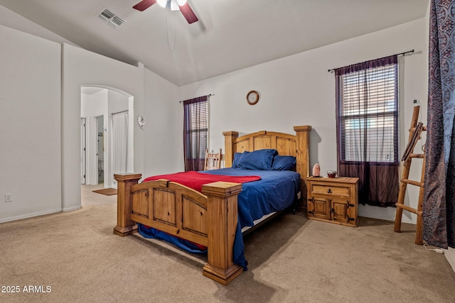 18057 W Port Royale Ln, Surprise, AZ 85388 - bedroom featuring arched walkways, carpet, vaulted ceiling, and visible vents