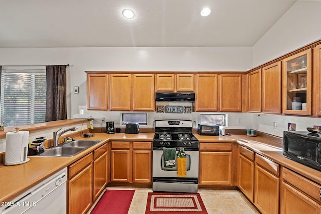 18057 W Port Royale Ln, Surprise, AZ 85388 - kitchen featuring light countertops, a sink, dishwasher, gas range, and extractor fan