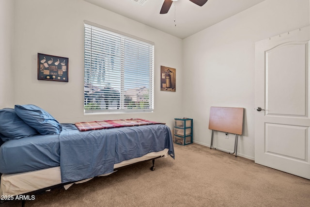 18057 W Port Royale Ln, Surprise, AZ 85388 - bedroom featuring baseboards, a ceiling fan, and carpet