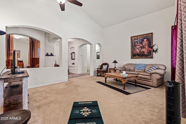 18057 W Port Royale Ln, Surprise, AZ 85388 - carpeted living area with arched walkways, high vaulted ceiling, and a ceiling fan