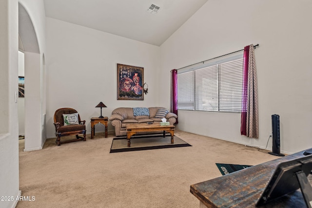 18057 W Port Royale Ln, Surprise, AZ 85388 - carpeted living area with baseboards, high vaulted ceiling, and visible vents