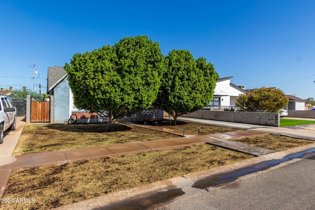 view of property hidden behind natural elements