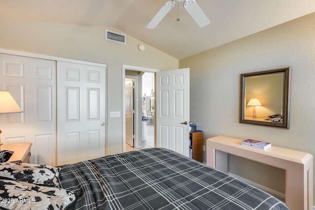 bedroom featuring ceiling fan, lofted ceiling, and a closet