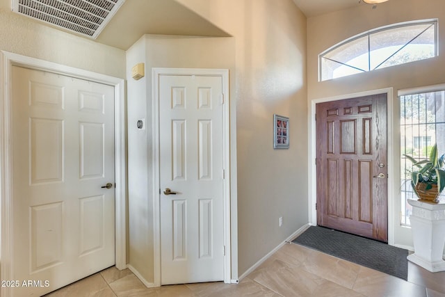 foyer featuring light tile patterned flooring