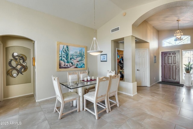 dining space featuring lofted ceiling