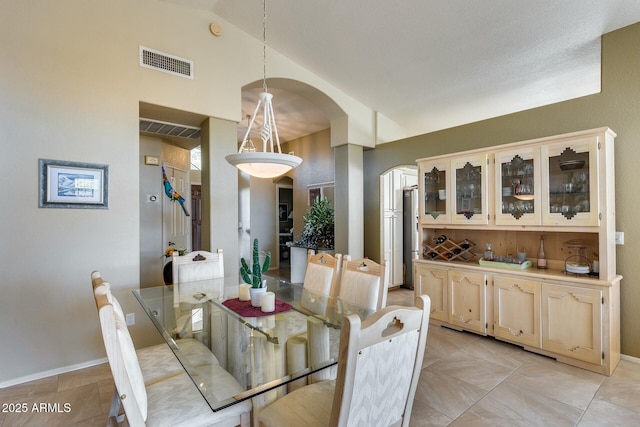 dining room featuring vaulted ceiling