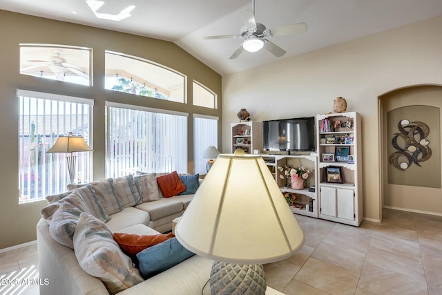 tiled living room with lofted ceiling and ceiling fan