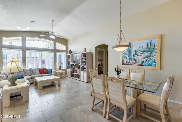 dining space featuring vaulted ceiling and ceiling fan