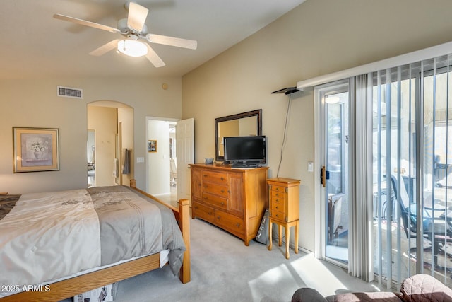 carpeted bedroom with vaulted ceiling, access to outside, and ceiling fan