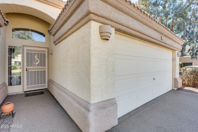 entrance to property featuring a garage