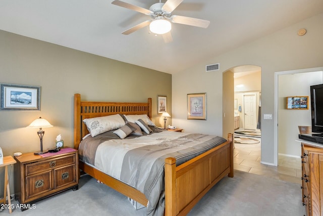 carpeted bedroom featuring ceiling fan and vaulted ceiling