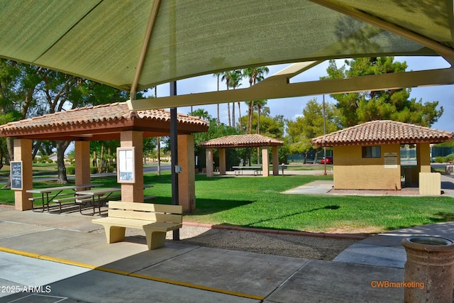 view of property's community featuring a gazebo and a lawn