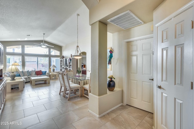 interior space with lofted ceiling and ceiling fan