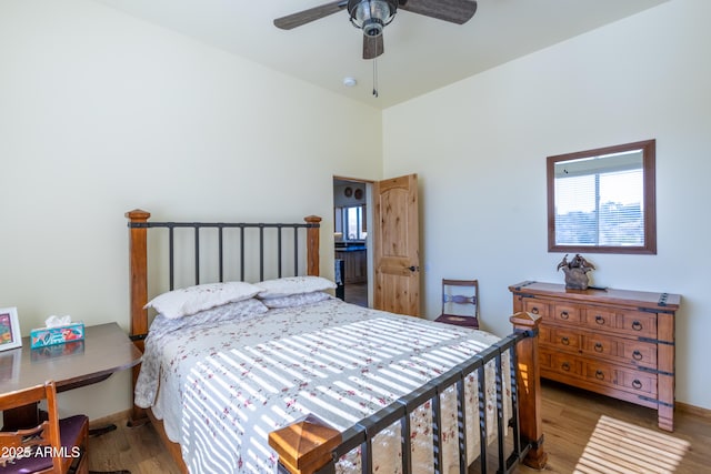 bedroom featuring ceiling fan and wood-type flooring