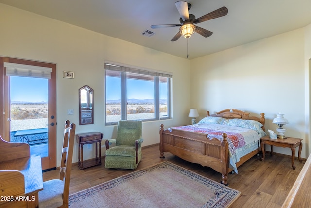 bedroom with light wood-type flooring, access to outside, and ceiling fan