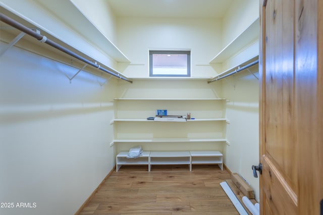 walk in closet featuring light hardwood / wood-style floors