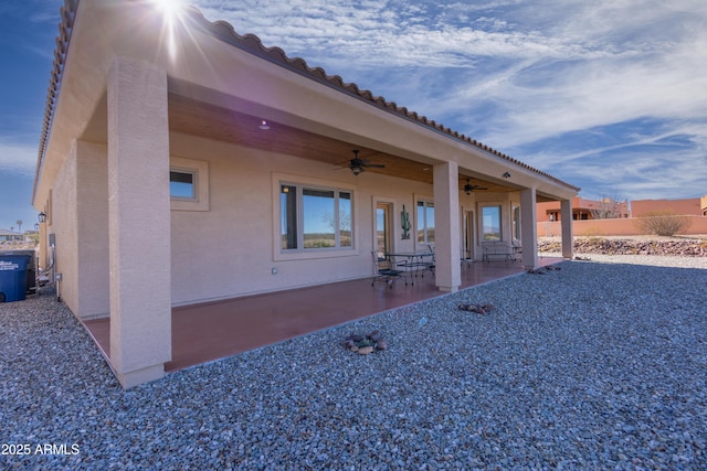 rear view of house with a patio area and ceiling fan