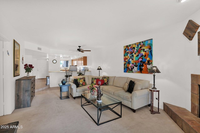 8651 E Royal Palm Rd Unit 121, Scottsdale, AZ 85258 - living area featuring a ceiling fan and light colored carpet