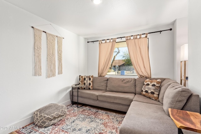 living room featuring baseboards