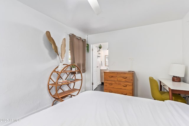 bedroom with ensuite bath and ceiling fan
