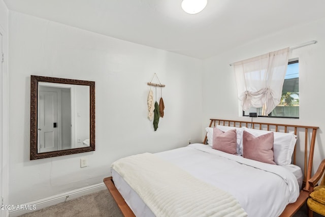 carpeted bedroom featuring baseboards