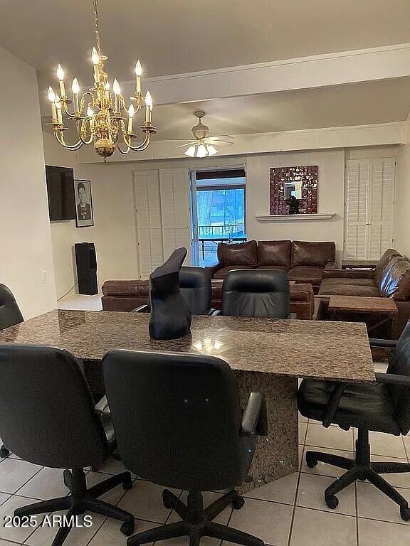 interior space featuring a ceiling fan and light tile patterned flooring