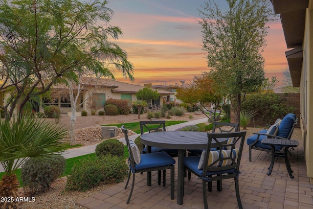 view of patio terrace at dusk