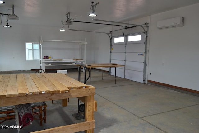 2740 E Walnut Dr, Show Low, AZ 85901 - garage with a wall mounted air conditioner, a garage door opener, and baseboards
