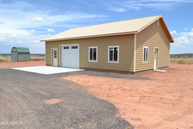2740 E Walnut Dr, Show Low, AZ 85901 - rear view of property with a garage, gravel driveway, and metal roof