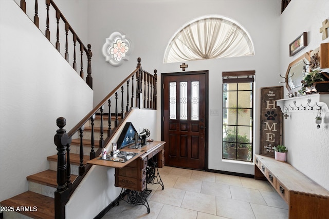 10532 W Catalina Dr, Avondale, AZ 85392 - entryway with a high ceiling, stairs, and light tile patterned floors