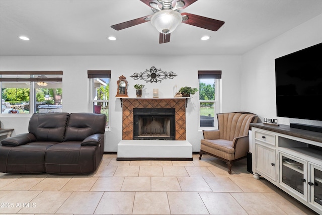 10532 W Catalina Dr, Avondale, AZ 85392 - living area with a fireplace with raised hearth, recessed lighting, ceiling fan, and light tile patterned floors