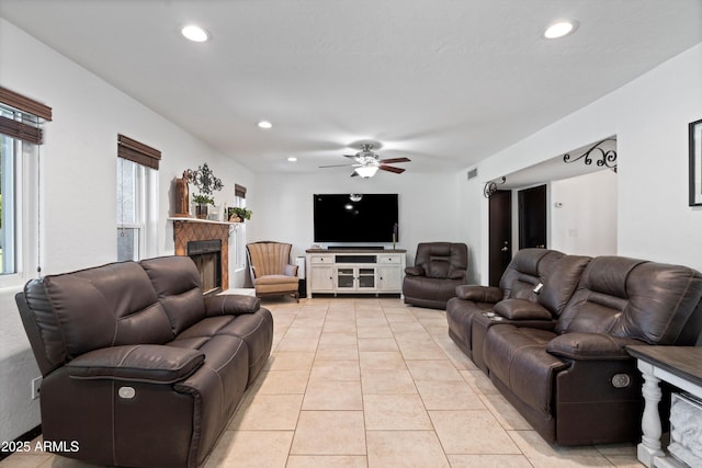 10532 W Catalina Dr, Avondale, AZ 85392 - living area with a fireplace, light tile patterned floors, a ceiling fan, and recessed lighting