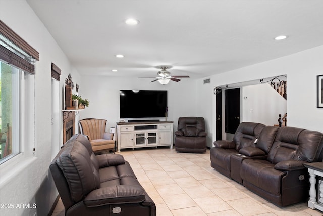 10532 W Catalina Dr, Avondale, AZ 85392 - living room with light tile patterned floors, a ceiling fan, plenty of natural light, and recessed lighting