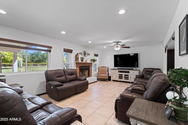 10532 W Catalina Dr, Avondale, AZ 85392 - living room featuring light tile patterned floors, recessed lighting, a tile fireplace, ceiling fan, and baseboards