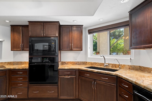 10532 W Catalina Dr, Avondale, AZ 85392 - kitchen with black appliances, a sink, light stone countertops, dark brown cabinets, and recessed lighting