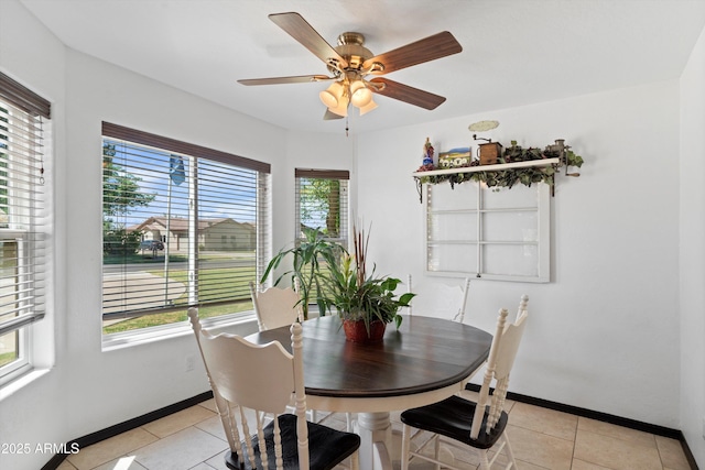 10532 W Catalina Dr, Avondale, AZ 85392 - dining room with light tile patterned flooring, ceiling fan, and baseboards