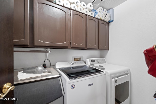 10532 W Catalina Dr, Avondale, AZ 85392 - clothes washing area featuring independent washer and dryer and cabinet space