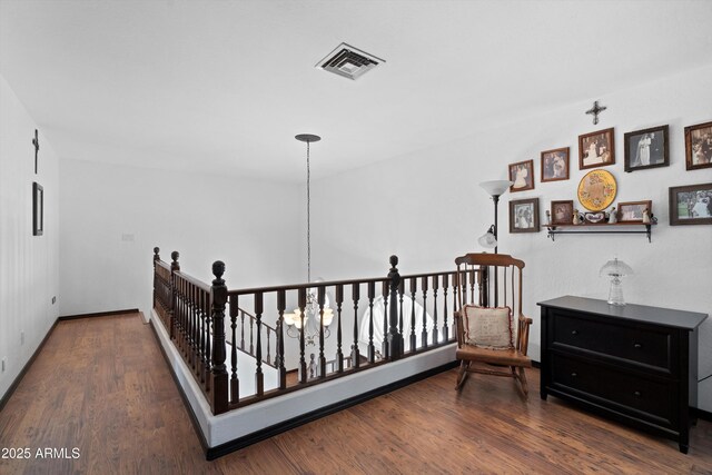 10532 W Catalina Dr, Avondale, AZ 85392 - hall with an upstairs landing, wood finished floors, a chandelier, and baseboards